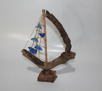 Driftwood Boat with Blue Sail