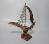 Driftwood Boat with Light Blue Sail