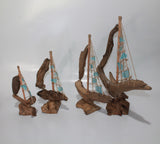 Driftwood Boat with Light Blue Sail